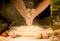 Men baker hands mixing, kneading preparation dough and making bread