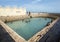 Men bathe at Vali North Pradeshiya Sabha (Keerimalai Sacred Bath) in the Jaffna region of Sri Lanka.