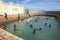 Men bathe at Vali North Pradeshiya Sabha (Keerimalai Sacred Bath) in the Jaffna region of Sri Lanka.