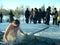 The men bathes in an ice-hole on the river