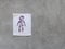 Men Bathroom Icon Sign Restroom or Toilet room on the cement wall.Male icon paper design.