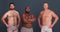 Men, body positive and face with diversity, community and people in studio and underwear. Portrait, group and grey