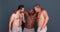 Men, body positivity and happy hug with diversity, confidence and happy in studio and underwear. Portrait, male group