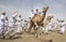 Men on camels at the start of a race