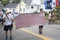 Men carry sign in the Wellfleet 4th of July Parade in Wellfleet, Massachusetts.