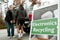 Men Carry TV To Drop Off At Recycling Event