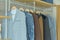 Men casual suits hanging in modern industrial style walk in closet