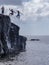 Men cliff jumping in Oahu