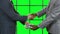 Men with dollars shaking hands.