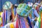 Men dressed in colorful clothes and hats in a popular religious festival