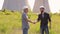 Men engineers shaking hands at construction site.