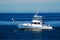 Men enjoy fishing on a calm day on the ocean