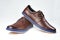 Men fashion brown shoe leather over white background. Pair casual stylish footwear