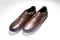 Men fashion brown shoe leather over white background. Pair casual stylish footwear