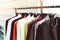 Men fashion clothes - Hanging clothes suit colorful or closet rack different coloured man suits in a closet on hangers in a store