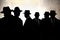 Men in fedora hats silhouette. Security, Privacy, Surveillance Concept.