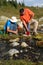 Men Filtering Water from Mountain Stream 4