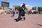 Men firefighter in fireproof suit and helmet rescues drags pulls maniken at fire-fighting competitions, Minsk, Belarus, 06.06.2018