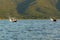 Men fishing on boat on Inle lake in Burma