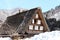 Men fixing the roof of Shirakawago traditional houses