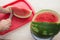 Men hand hold from on fresh watermelon cutting for eatin on table background