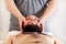 Men hands masseuse for massage the head of a guy