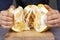 Men hands open pomelo. peeling fruit close up