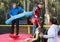 Men having funny wrestling by inflatable logs