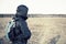 Men hiker portrait in the field with backpack and poles