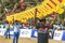 Men hold up sections of a Japanese kite on Negombo beach in Sri Lanka.