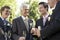 Men Holding Empty Champagne Flutes At Wedding