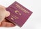 Men holding turkish passport on white background