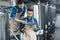 Men inspectors with digital tablet technician inspecting modern beer factory plant