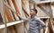 Men looking at parquet board for home flooring in store