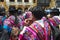 Men making music with andean musical instruments like zampata,guena,pututo at a festival dressed in colorful traditional