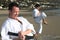 Men practicing Karate beach