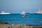 Men practicing Paddle Surf in Es Calo beach in Formentera in summer 2021