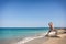 Men practicing yoga on the beach in Greece, in position re