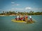 Men pusshing primitive boat with bamboo, in Ceara, Brazil