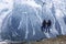 Men ride on chair lift in the mountains. Winter sports and active tourism and recreation. Beautiful landscape