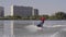 Men ride a jetski on a river