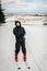 Men rides, rises on a ski lift, on skiing a on snow in Carpathian mountains. On background forest and ski slopes. Close up. Winter