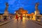 Men in Roman soldier costumes the Saint Angel bridge in Rome at dusk, Italy