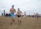 Men running on the beach, Belgium