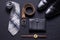 Men`s accessories on black background tie wallet watch strap sho