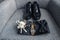 Men\\\'s accessories for the groom on the wedding day in the form of shoes, a watch and a boutanniere made of fresh flowers