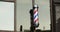 Men`s beauty salon. Barbershop. Symbol of the barber, pole.