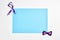 Men\\\'s bow tie and ribbon with blank blue paper
