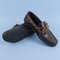 Men`s brown moccasins, loafers isolated on blue background