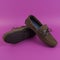 Men`s brown moccasins, loafers isolated on pink background